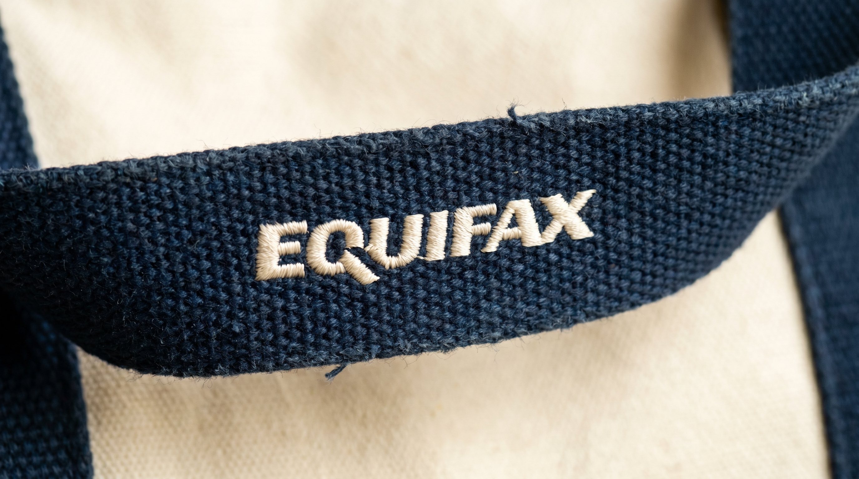 EQUIFAX embroidered wordmark on woven canvas strap